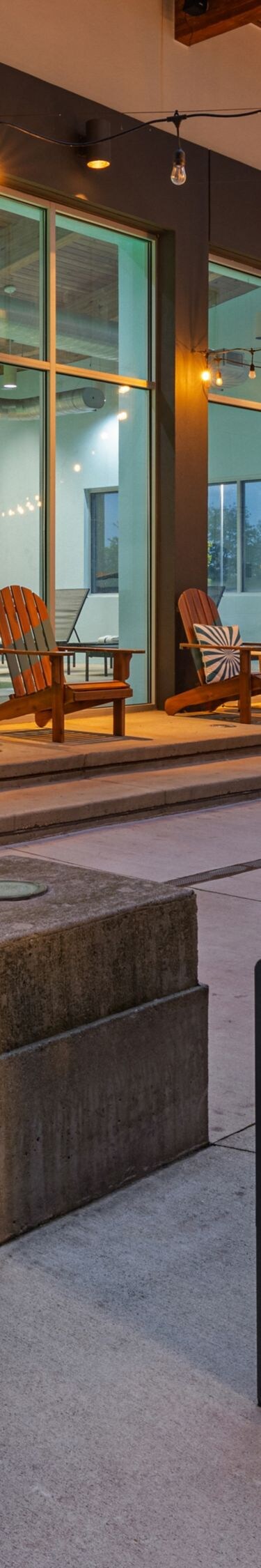 Courtyard seating beneath glowing string lights