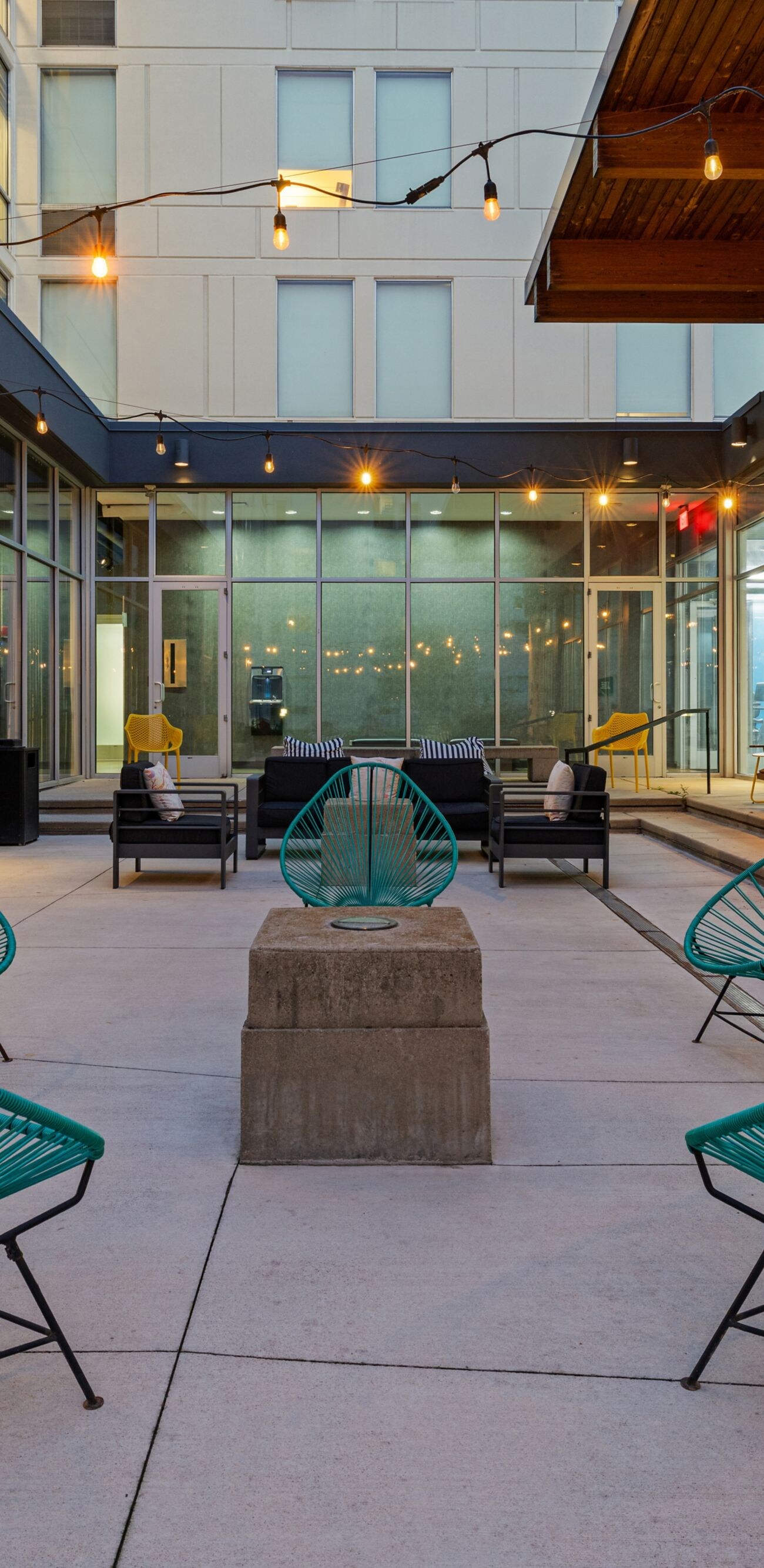 Courtyard with colorful chairs and fireplace
