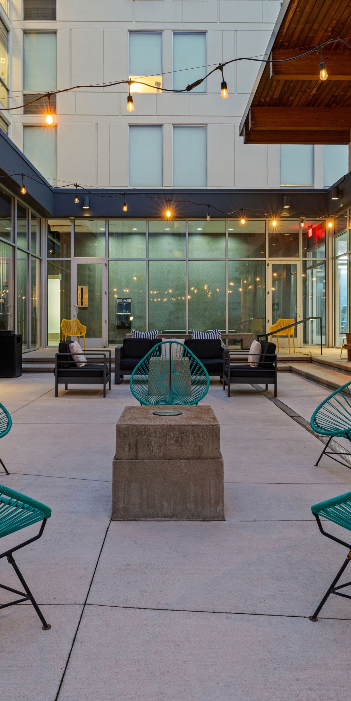 Courtyard with colorful chairs and fireplace