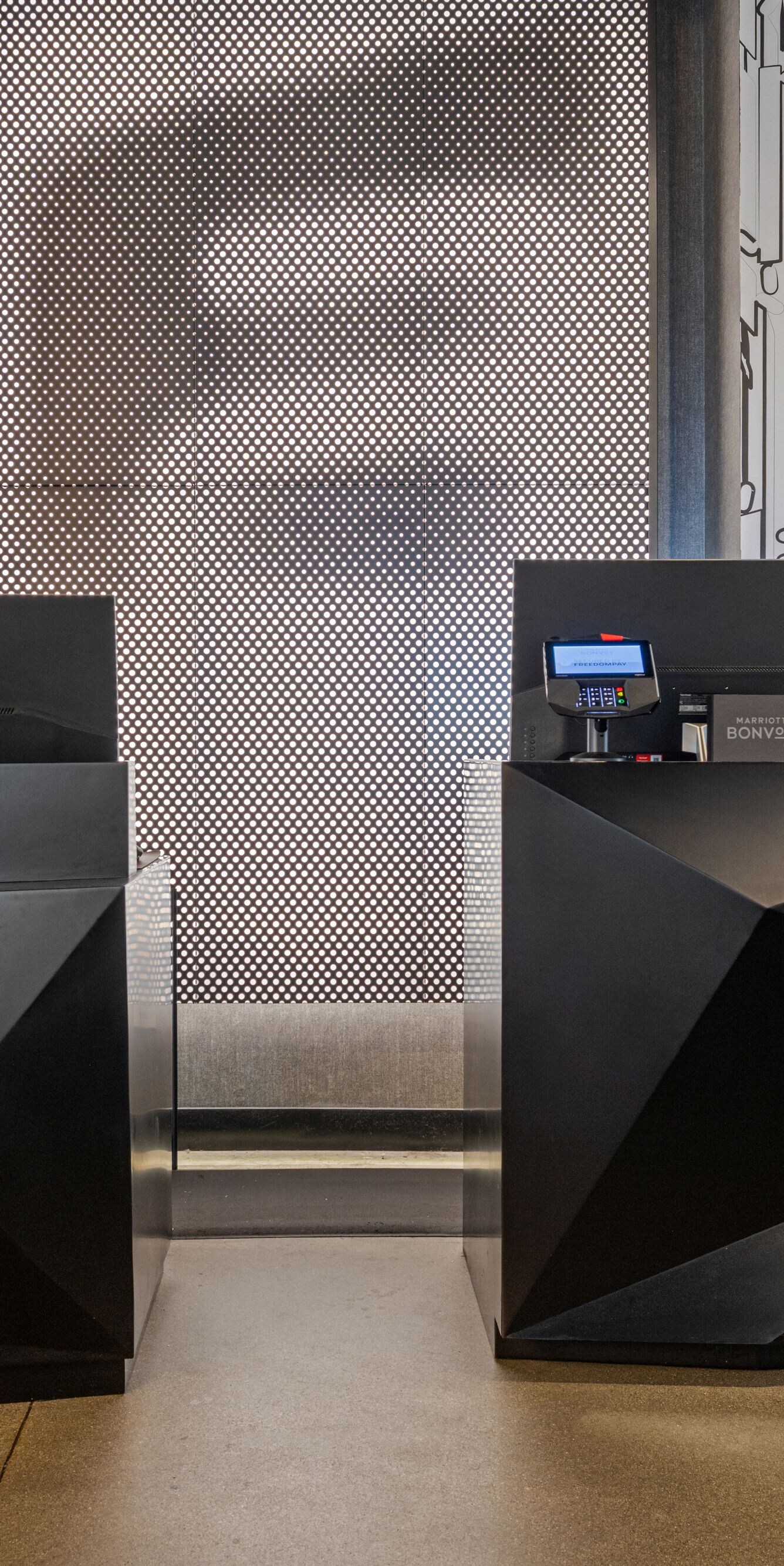 Geometric front desks in reception area