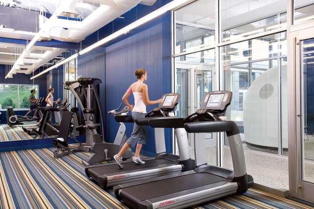 Person running on a treadmill. 