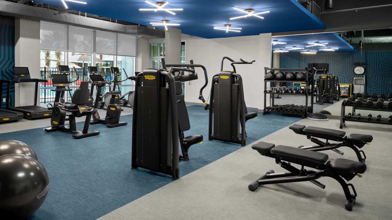 A fitness room with exercise equipment