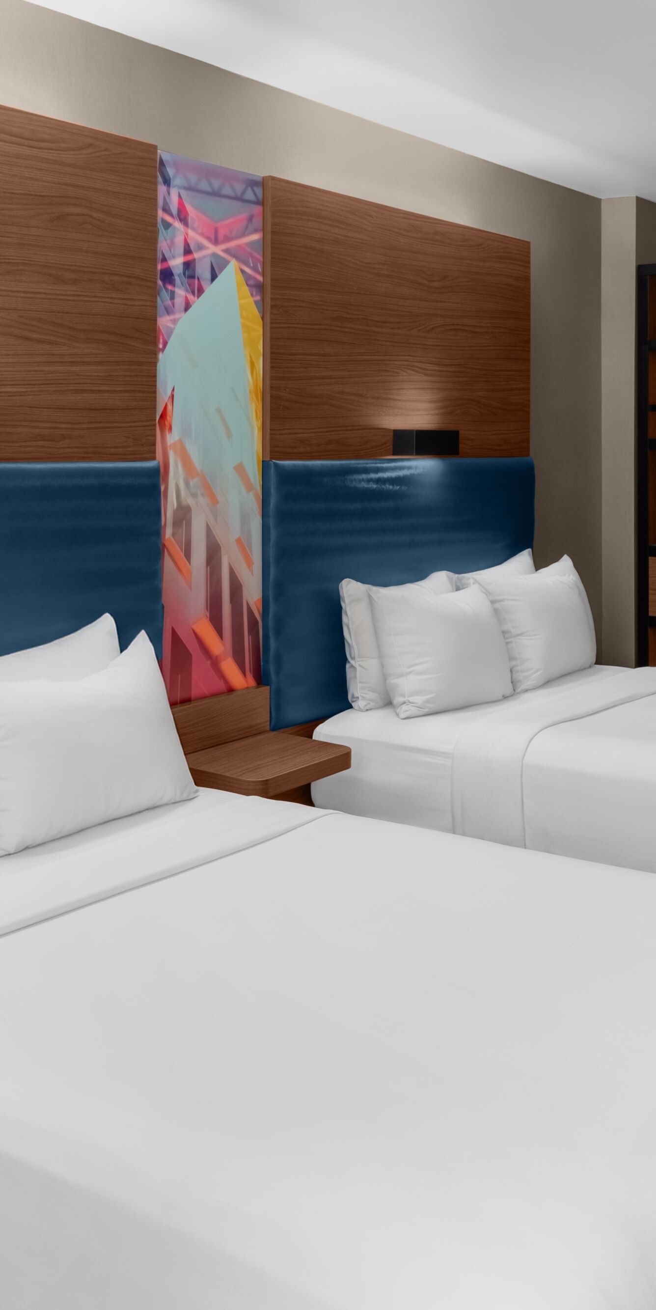 Double guest room with modern blue headboard