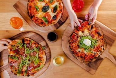 Woodfired Pizza enjoyed with redwine