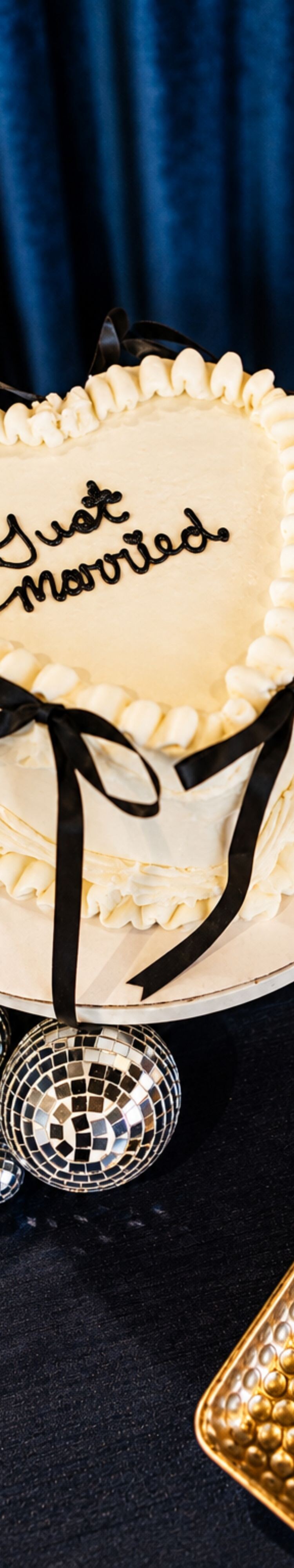 Heart-shaped wedding cake and utensils 