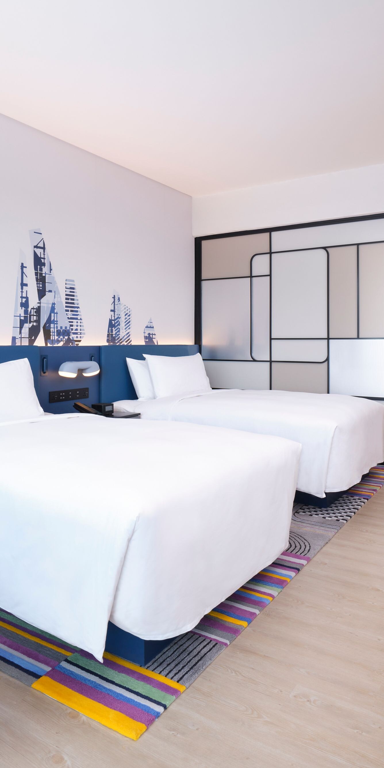 Guest room beds with sofa, table, TV