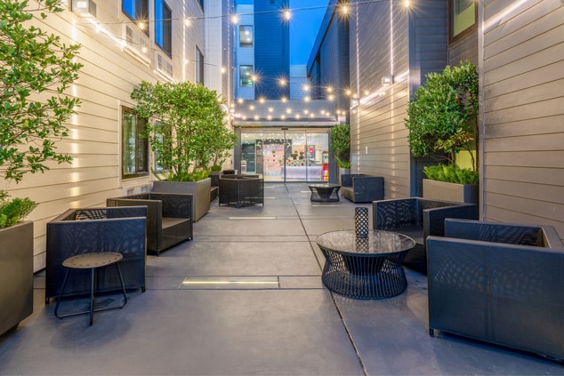 hotel entrance, outdoor seating and lighting