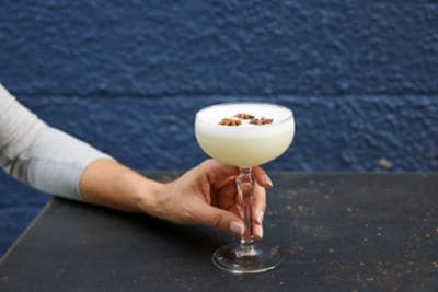 A person holding a cocktail