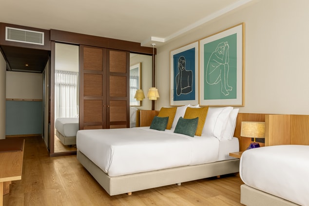 Junior Suite, king size bed, wardrobe and corridor