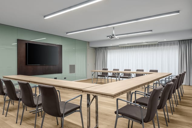 Meeting room, tables and chairs in u-shape set up