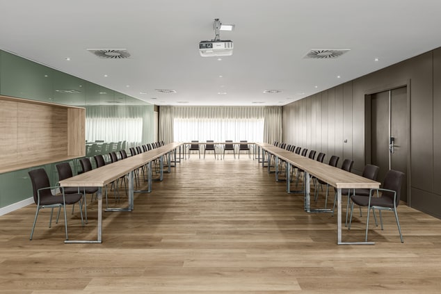 Meeting room, tables and chairs in U-shape set up