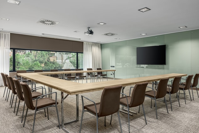 Meeting room, tables and chairs in U-shape set up