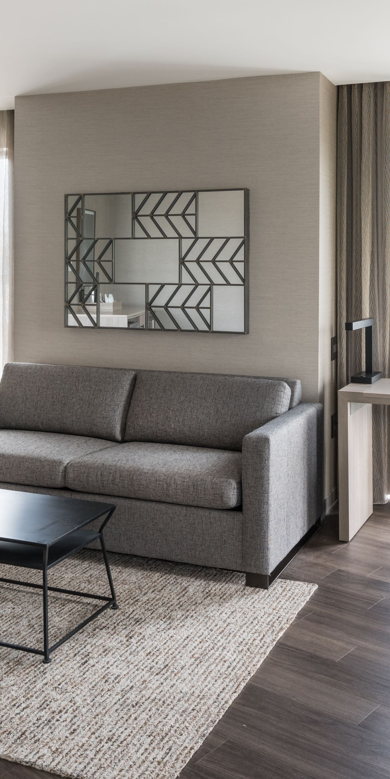 Living area with couch, desk and chair.