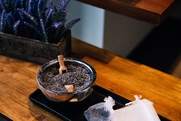 bowl of dried lavender next to sheer white bags