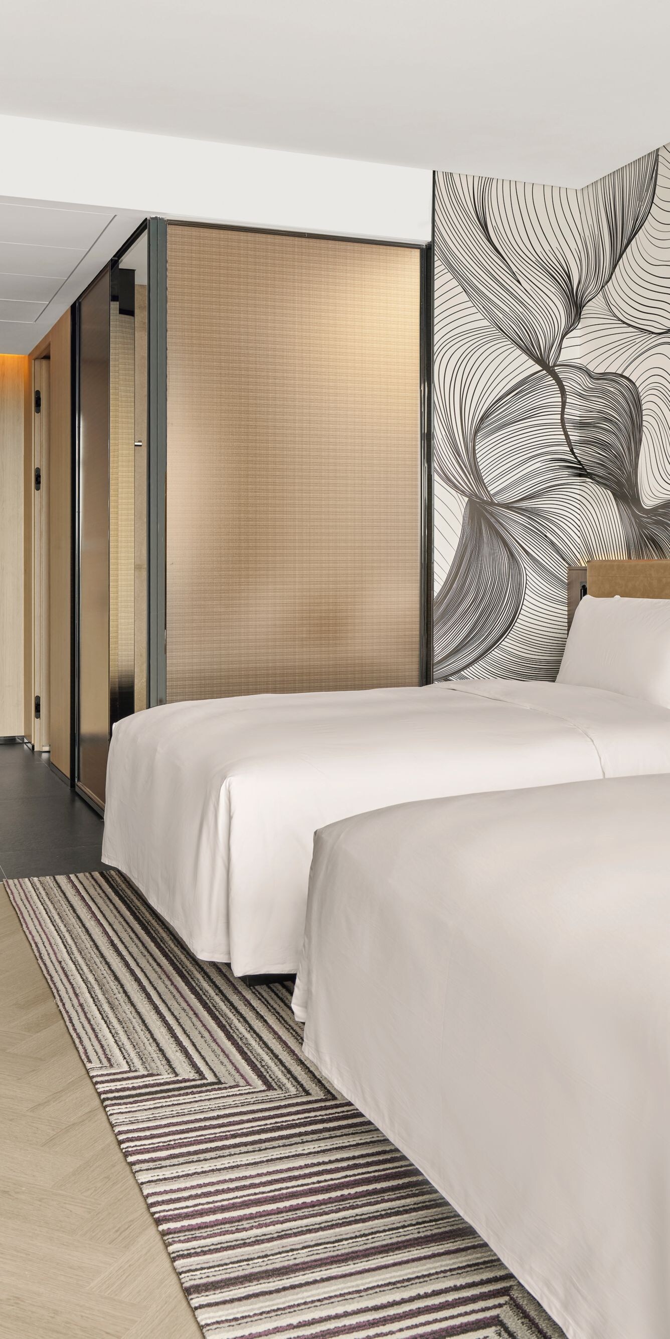 Two double beds in modern guest room 
