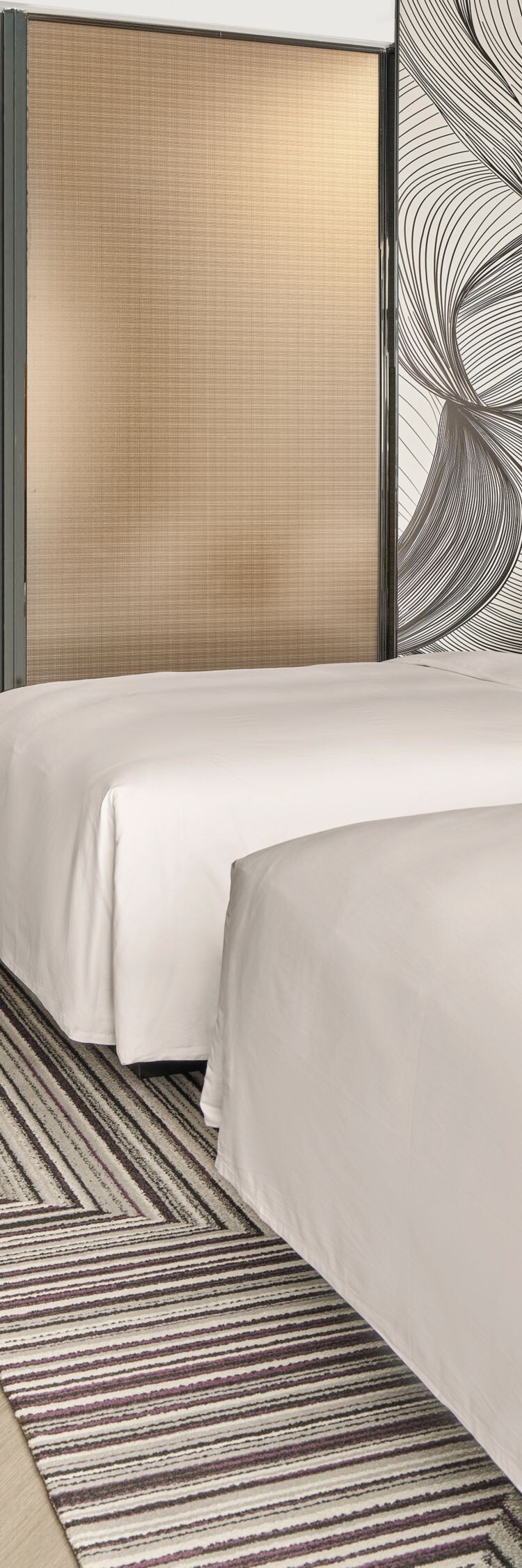 Two double beds in modern guest room 