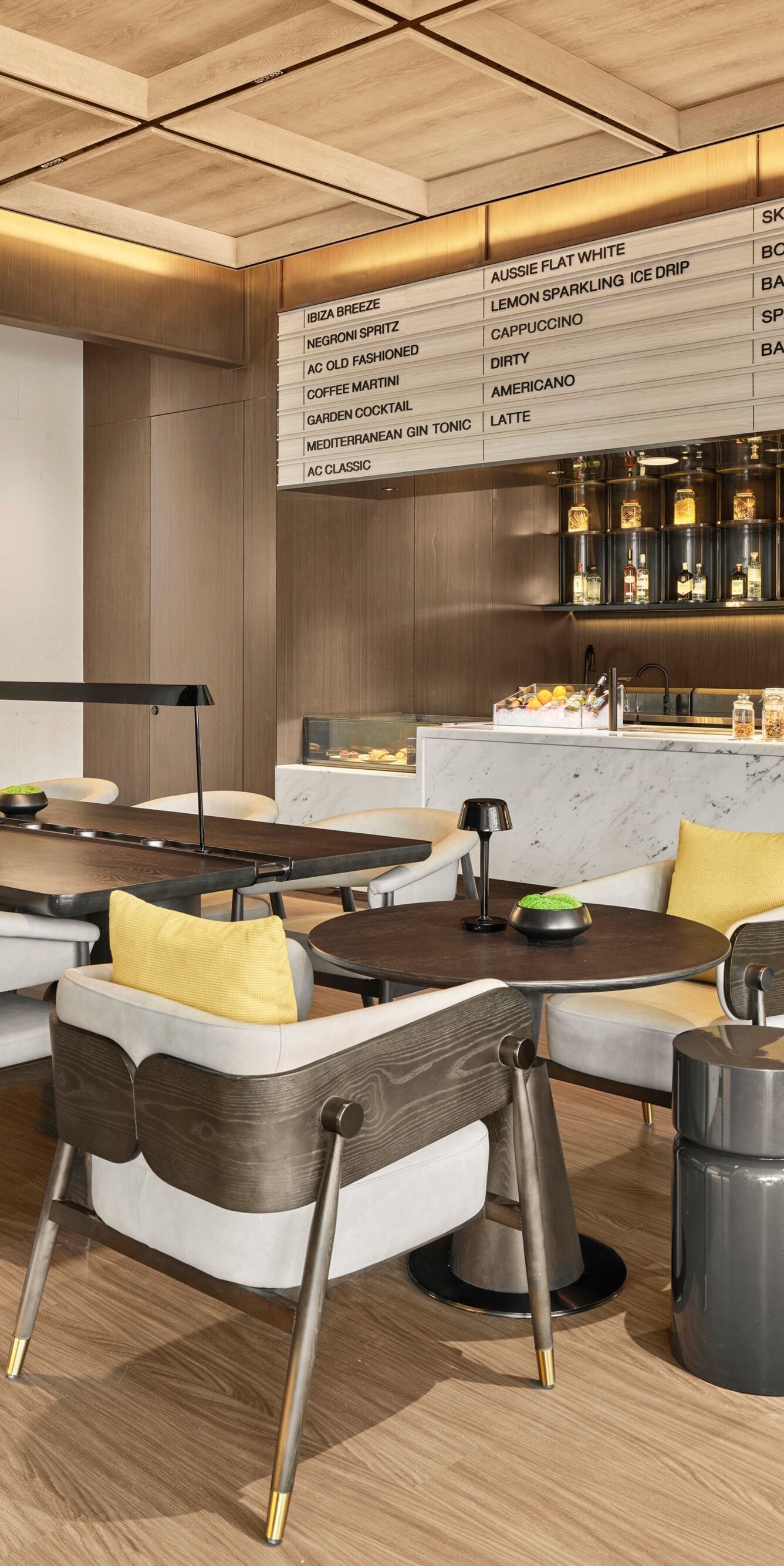 AC Café seating area with tables and coffee bar