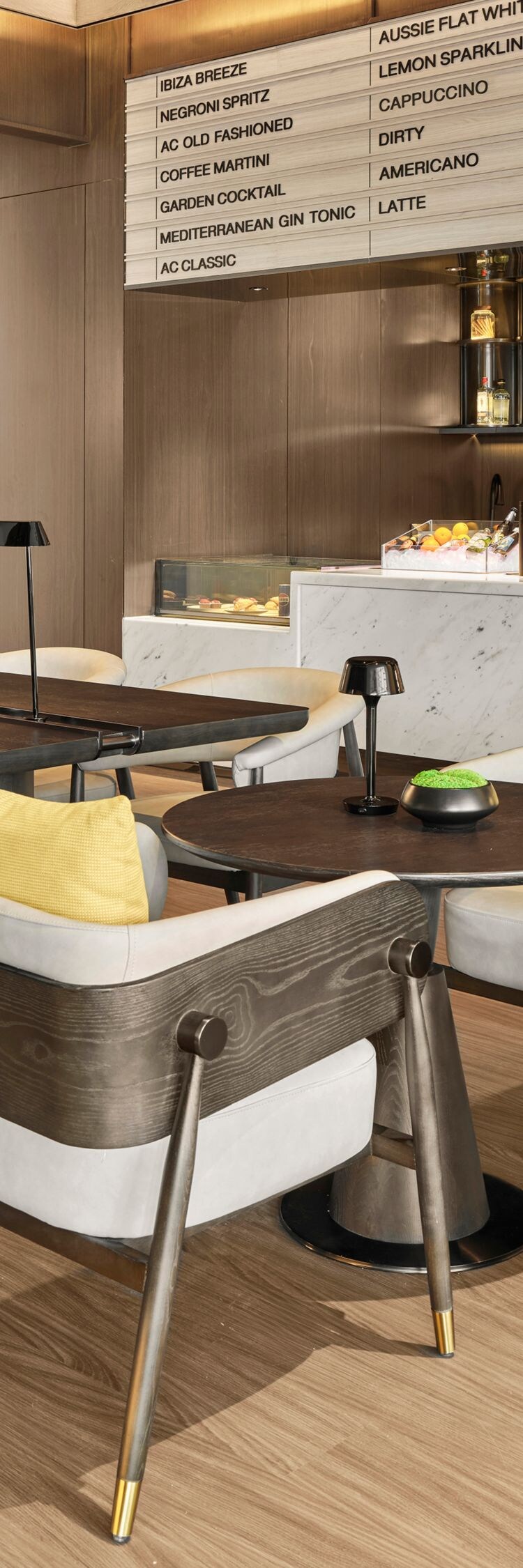 AC Café seating area with tables and coffee bar