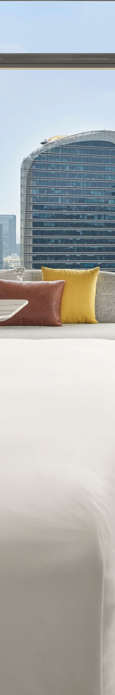 Modern guest room with king bed and skyline view