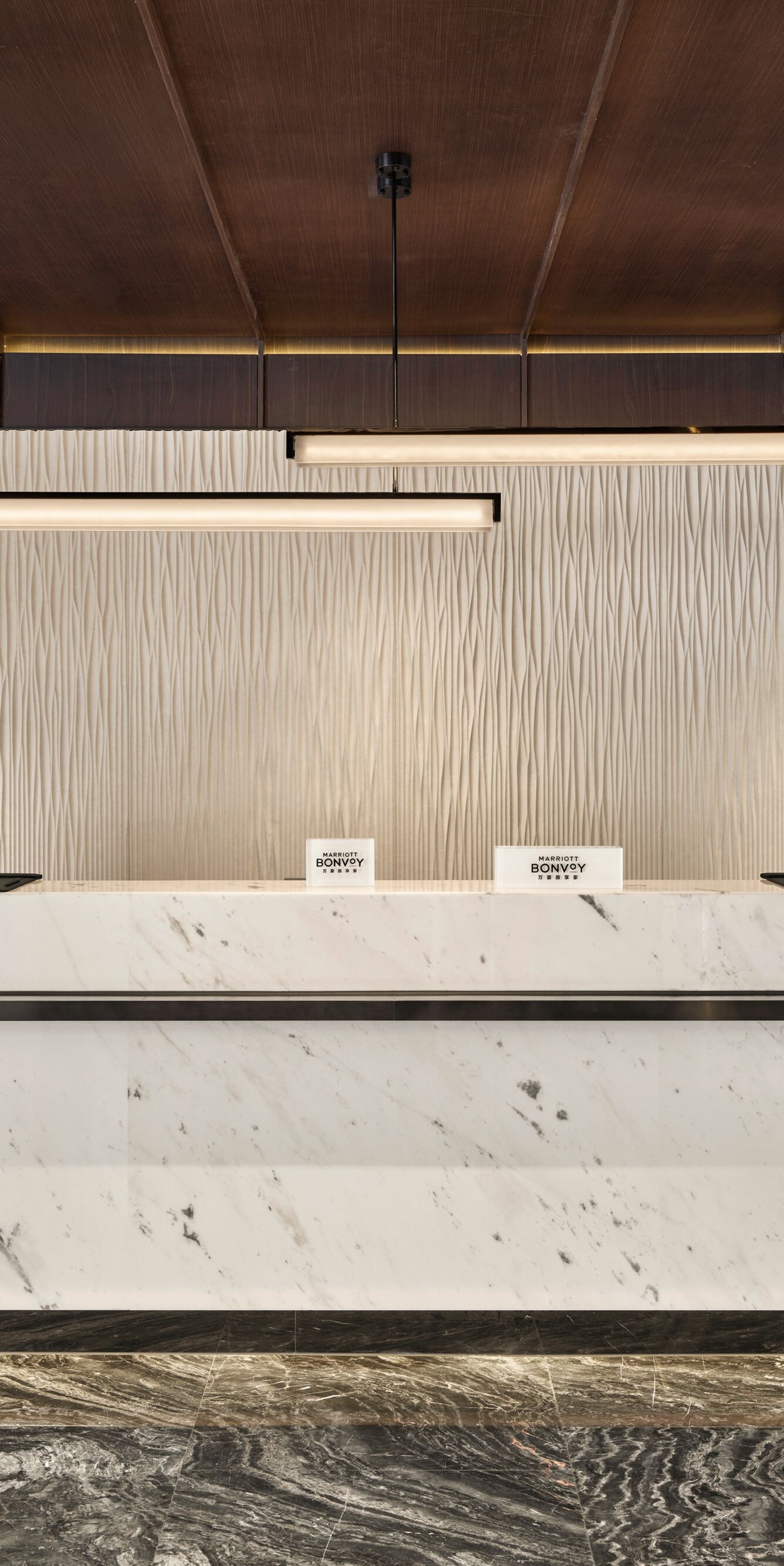 Modern hotel reception desk with marble counter