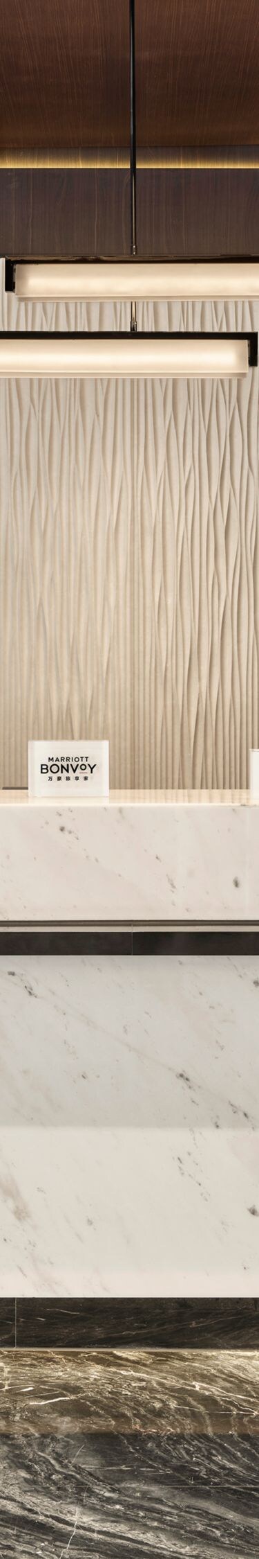 Modern hotel reception desk with marble counter