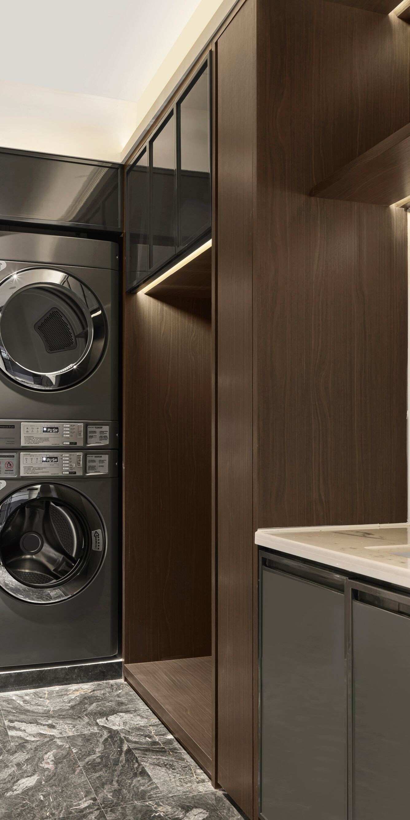 Guest laundry room with washers, dryers, and sink