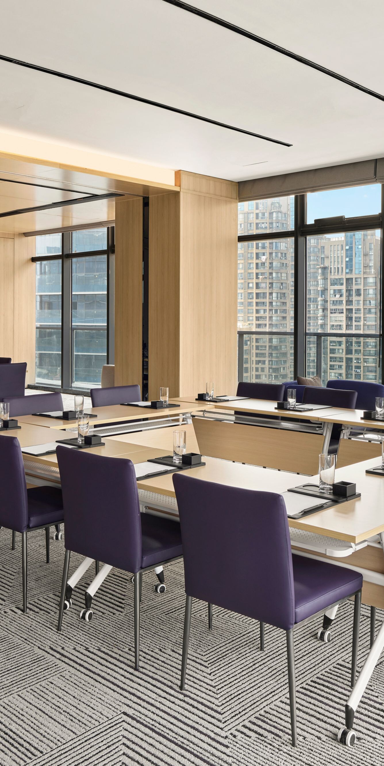 Boardroom with U-shaped meeting table setup