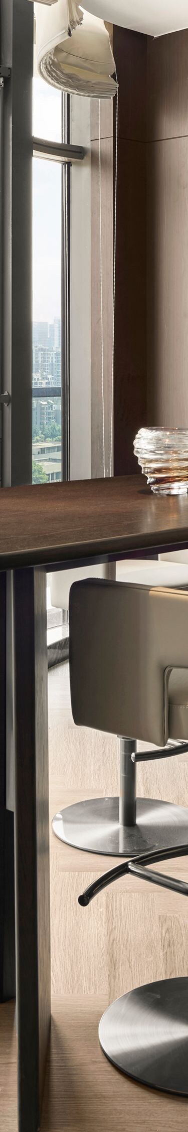 Window-side seating area with table and city view