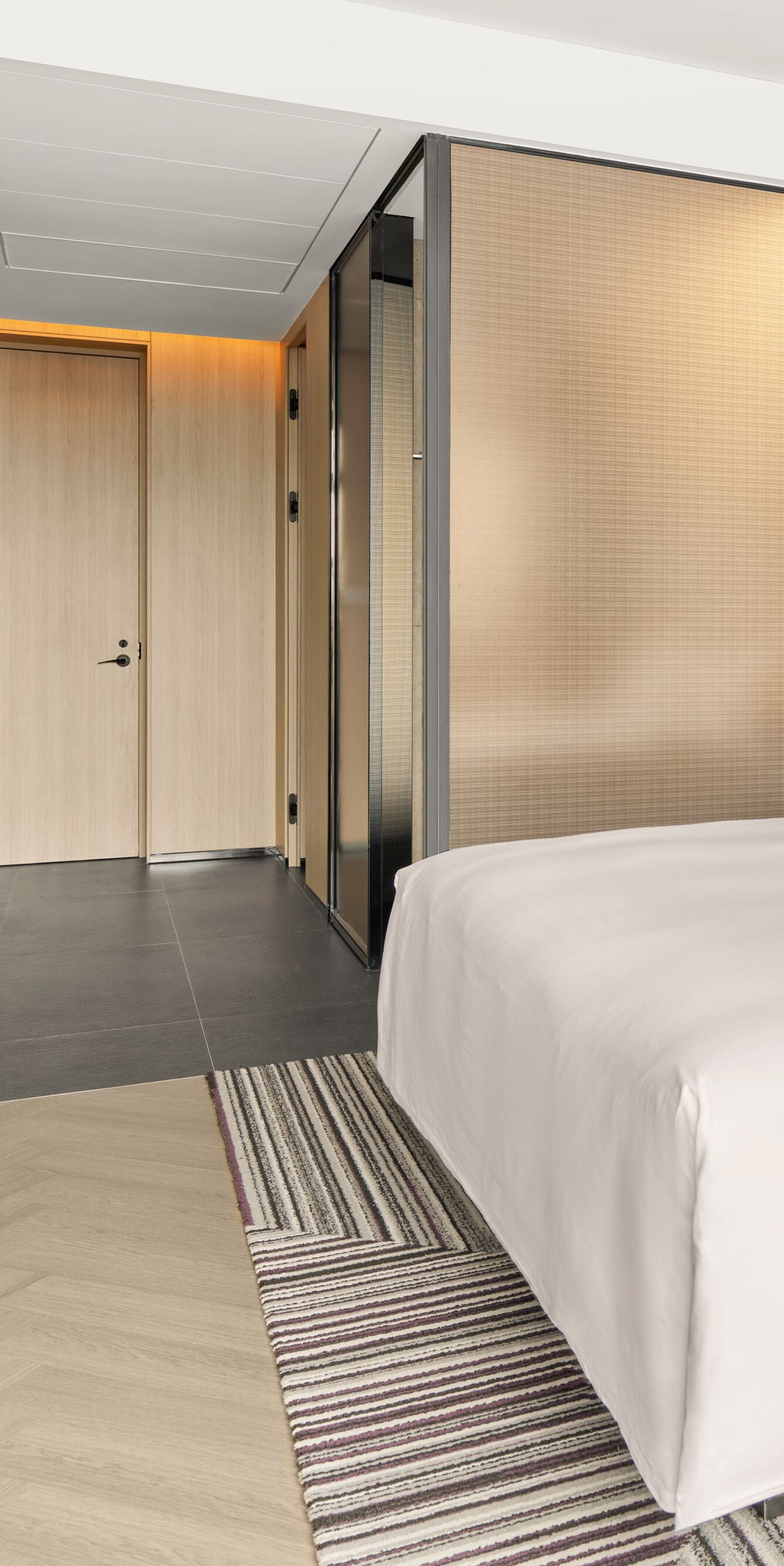 Modern guest room with king bed and workspace