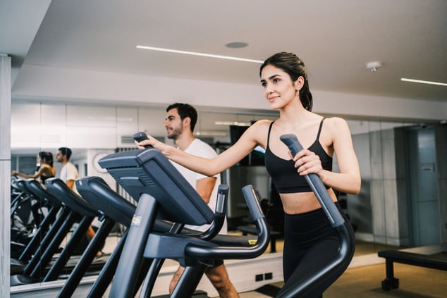 Couple exercising at the fitness center.