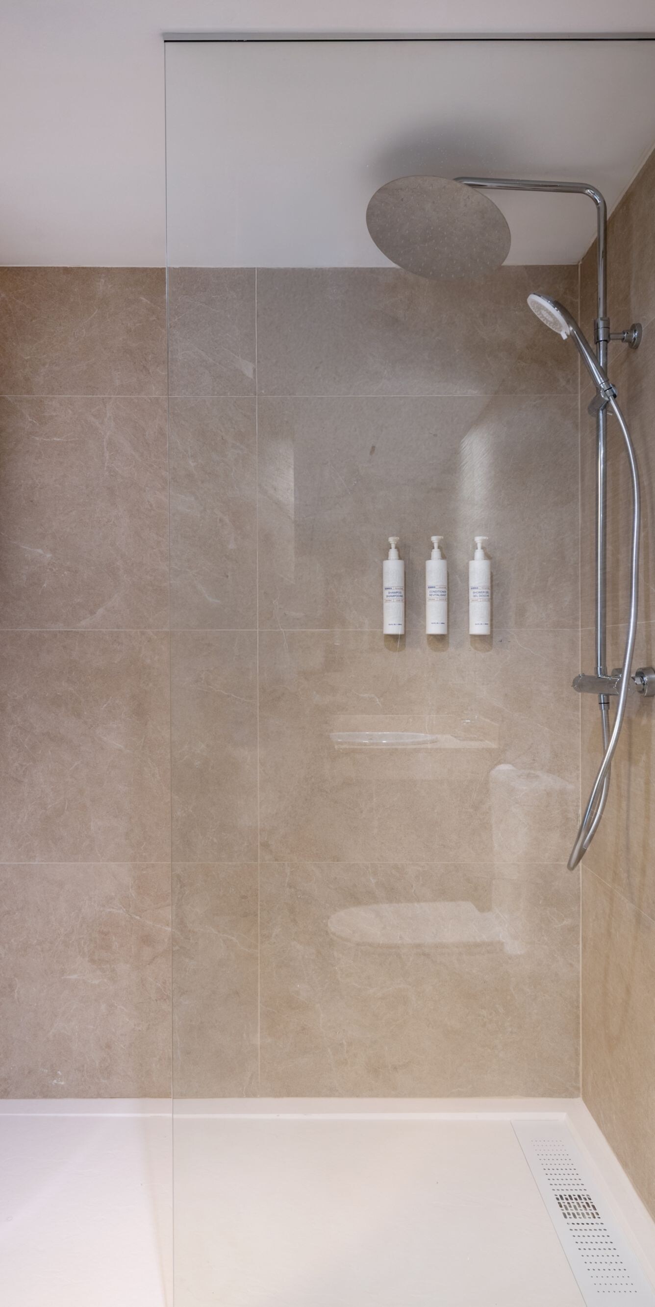 Walk-in shower with rainfall showerhead