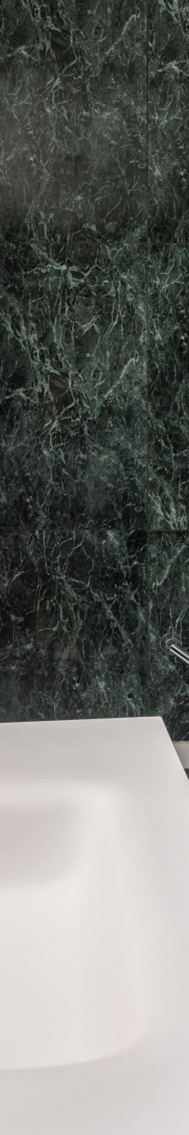Bathroom with marble walls and rain shower