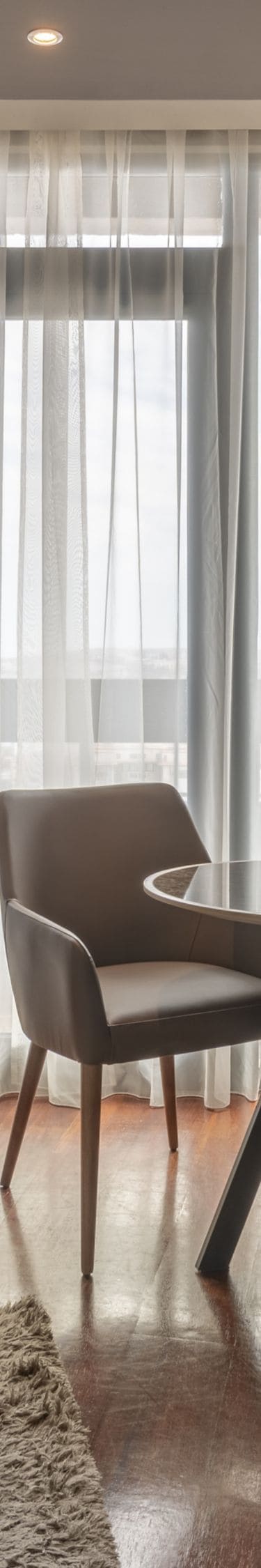 Suite living area with table and balcony