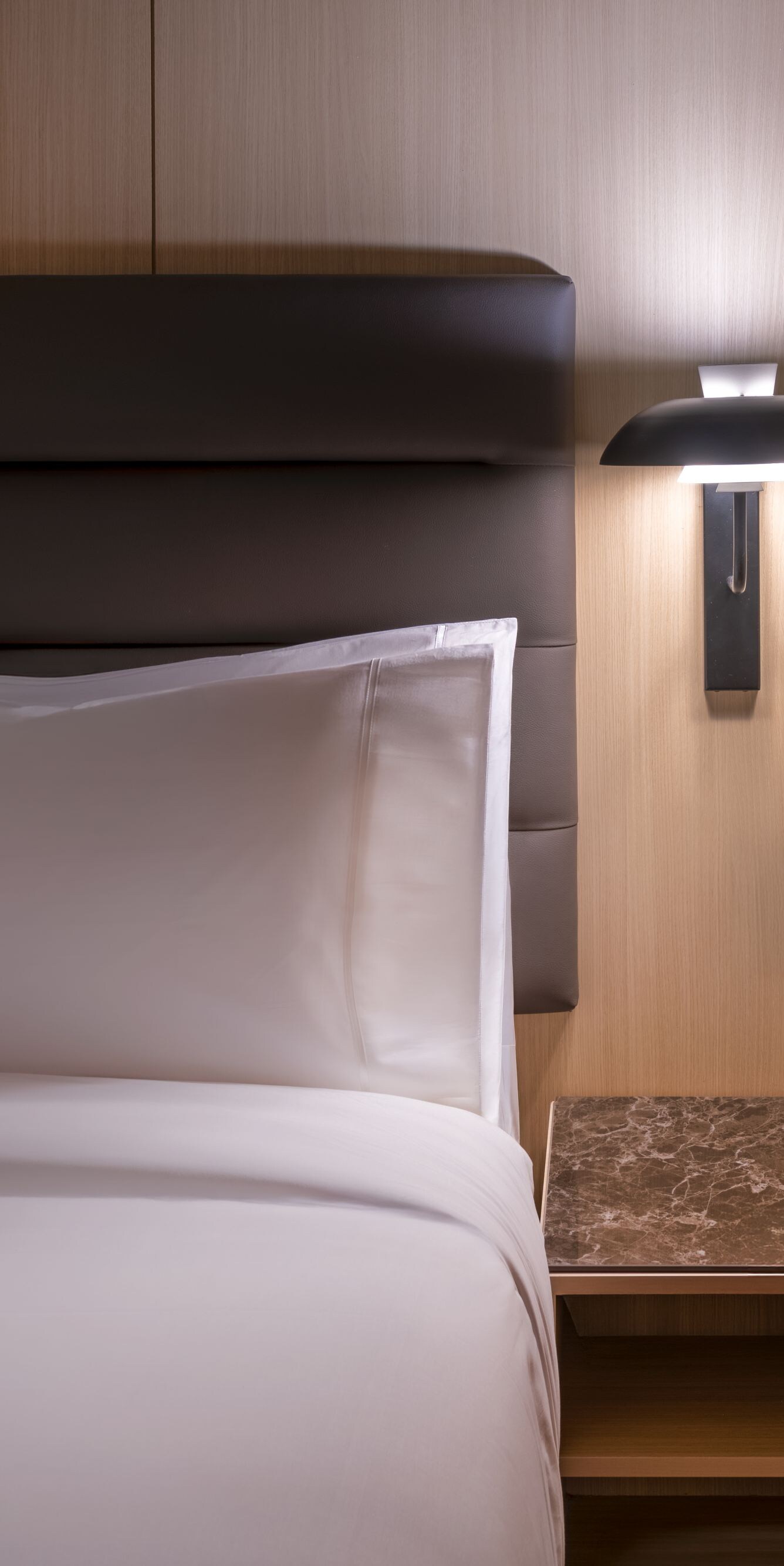King bed with marble nightstand and lamp