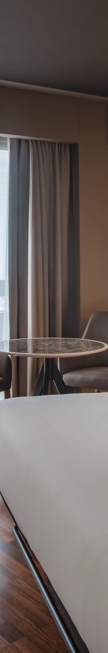 King guest room with seating and city view