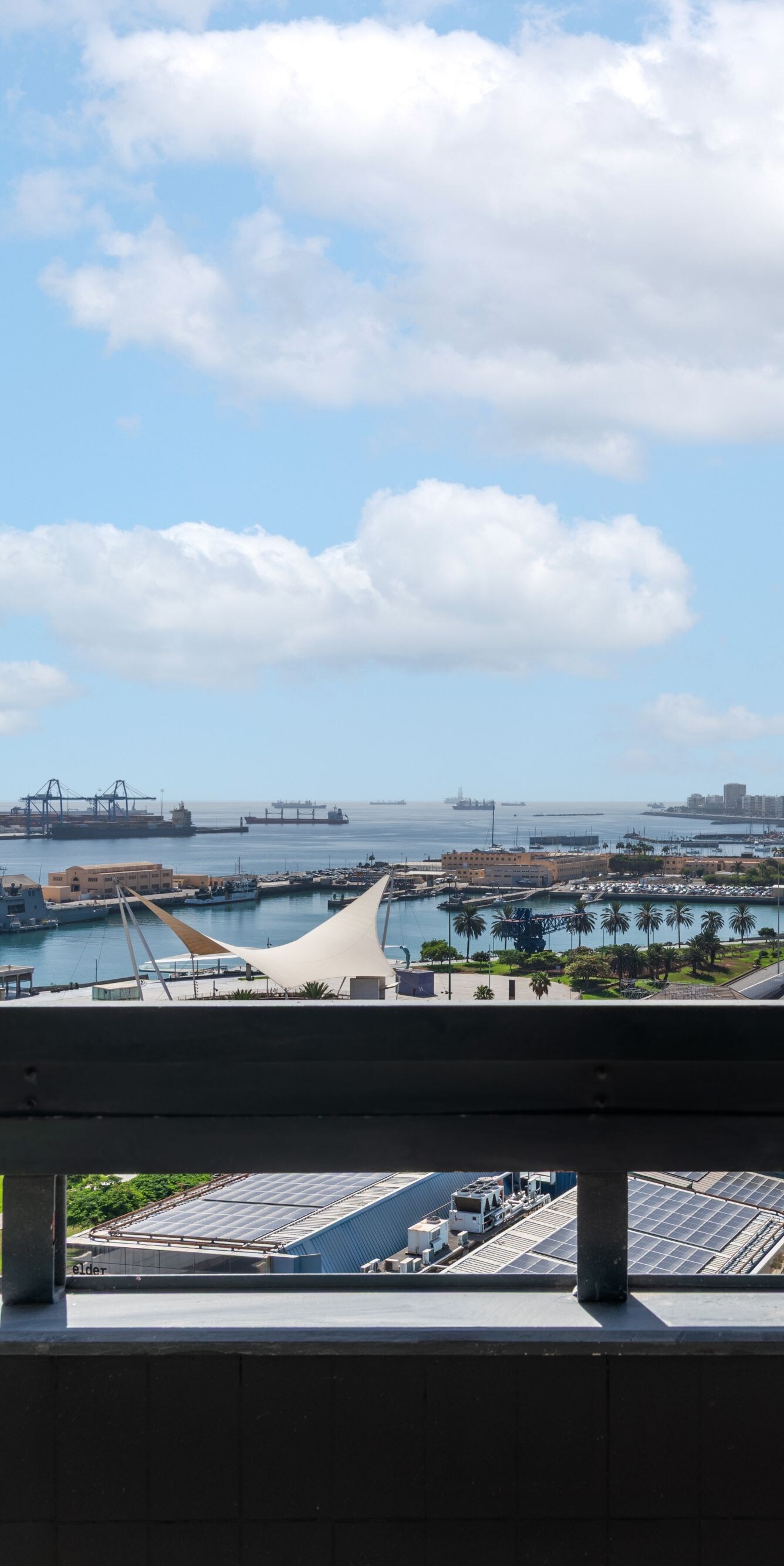 Balcony view overlooking harbor and city