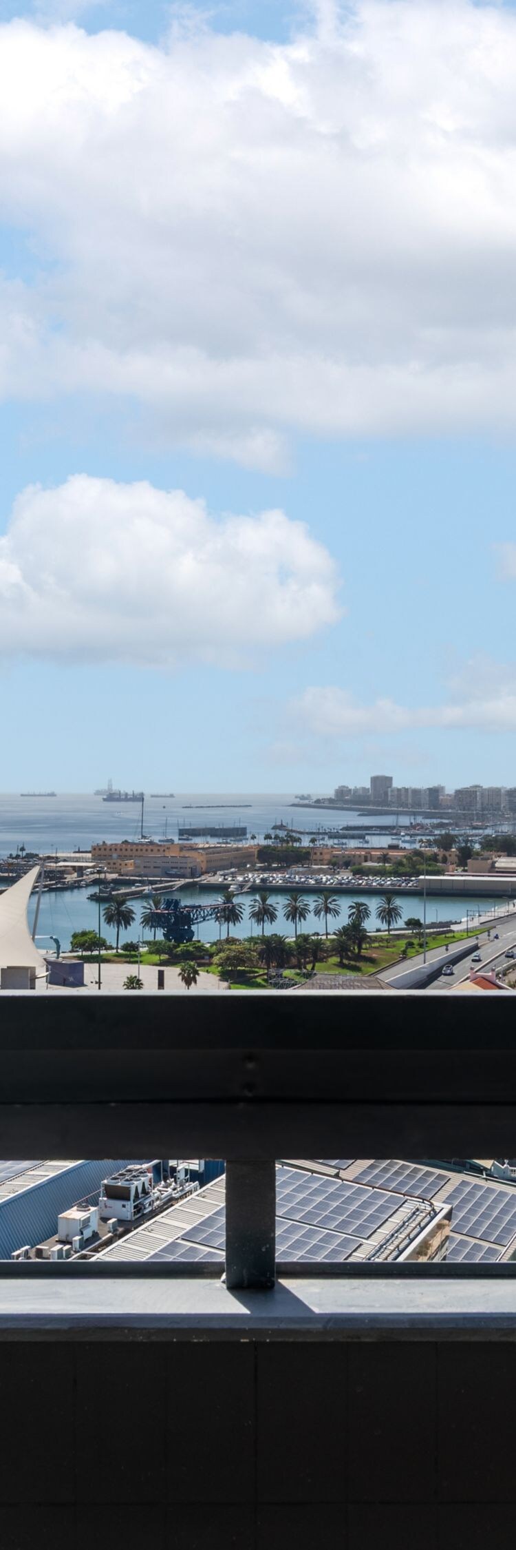 Balcony view overlooking harbor and city