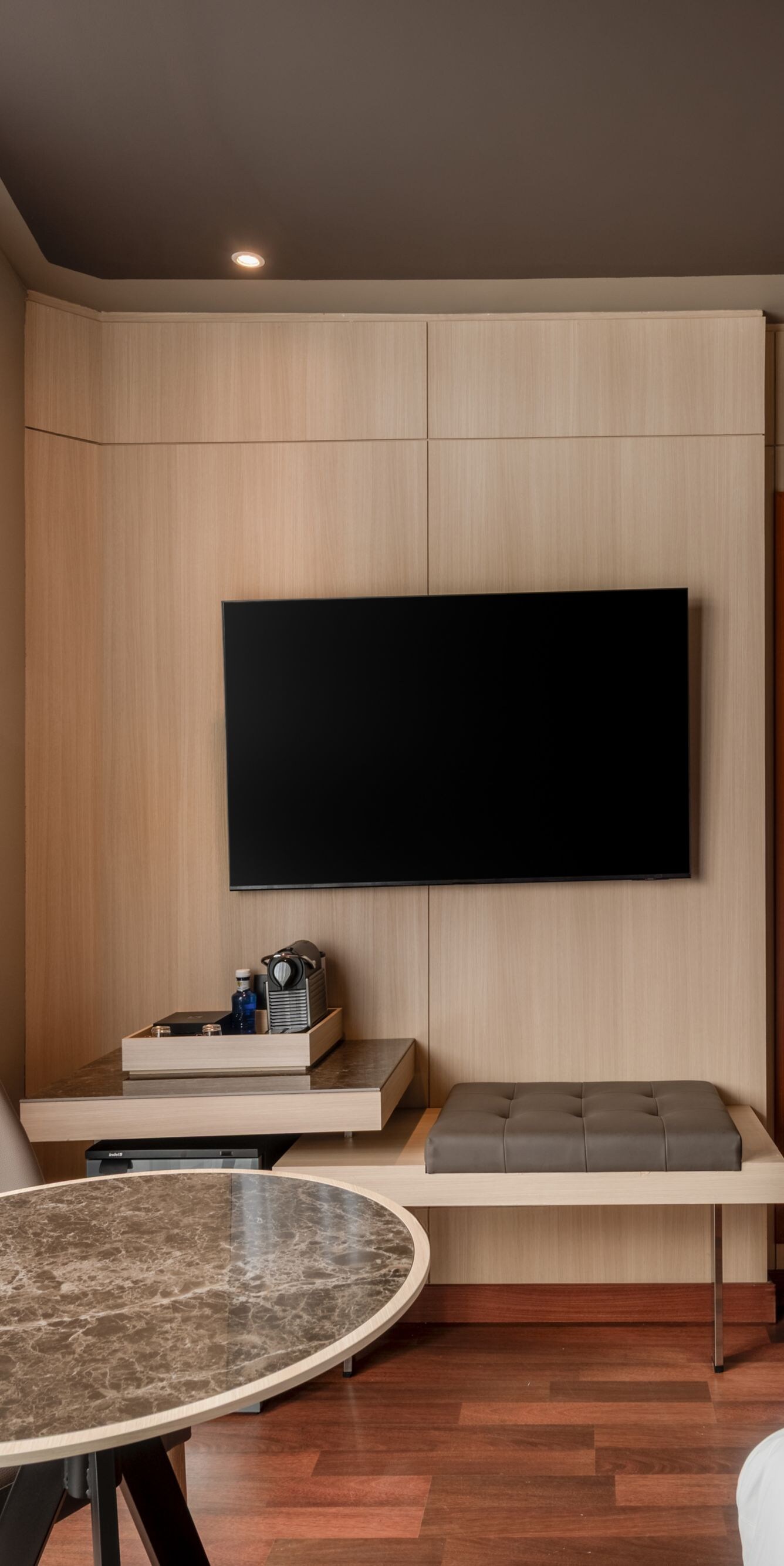 Guest room with marble table and TV