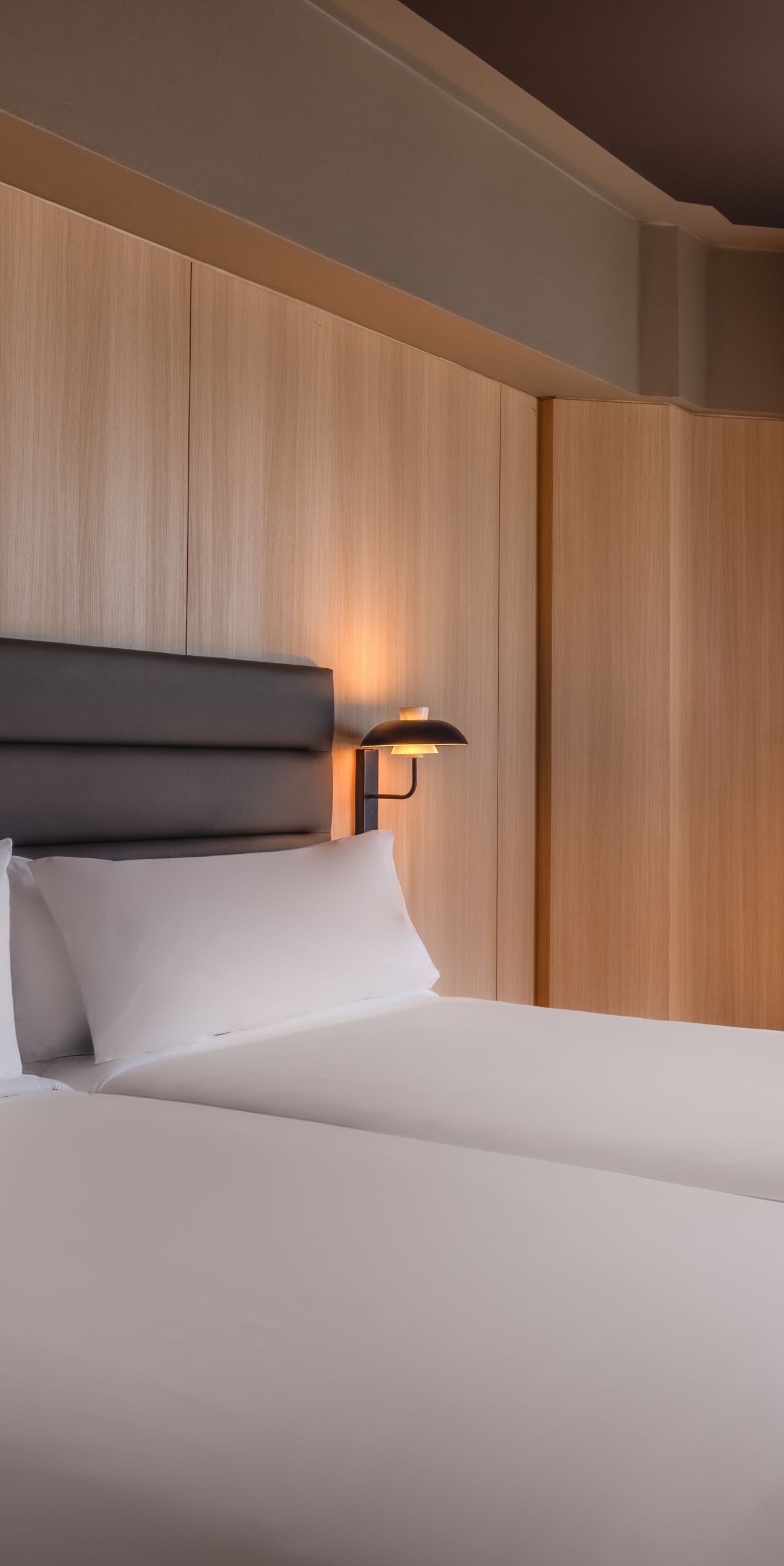 Guest room with two beds and seating area