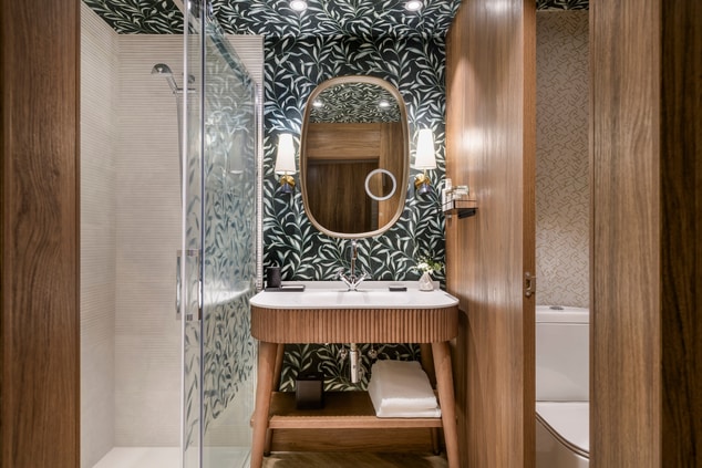 shower, mirror, vanity with sink
