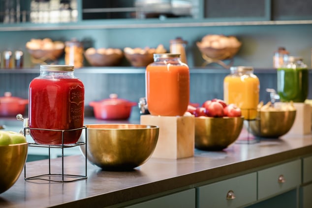 A breakfast bar with colorful jars.