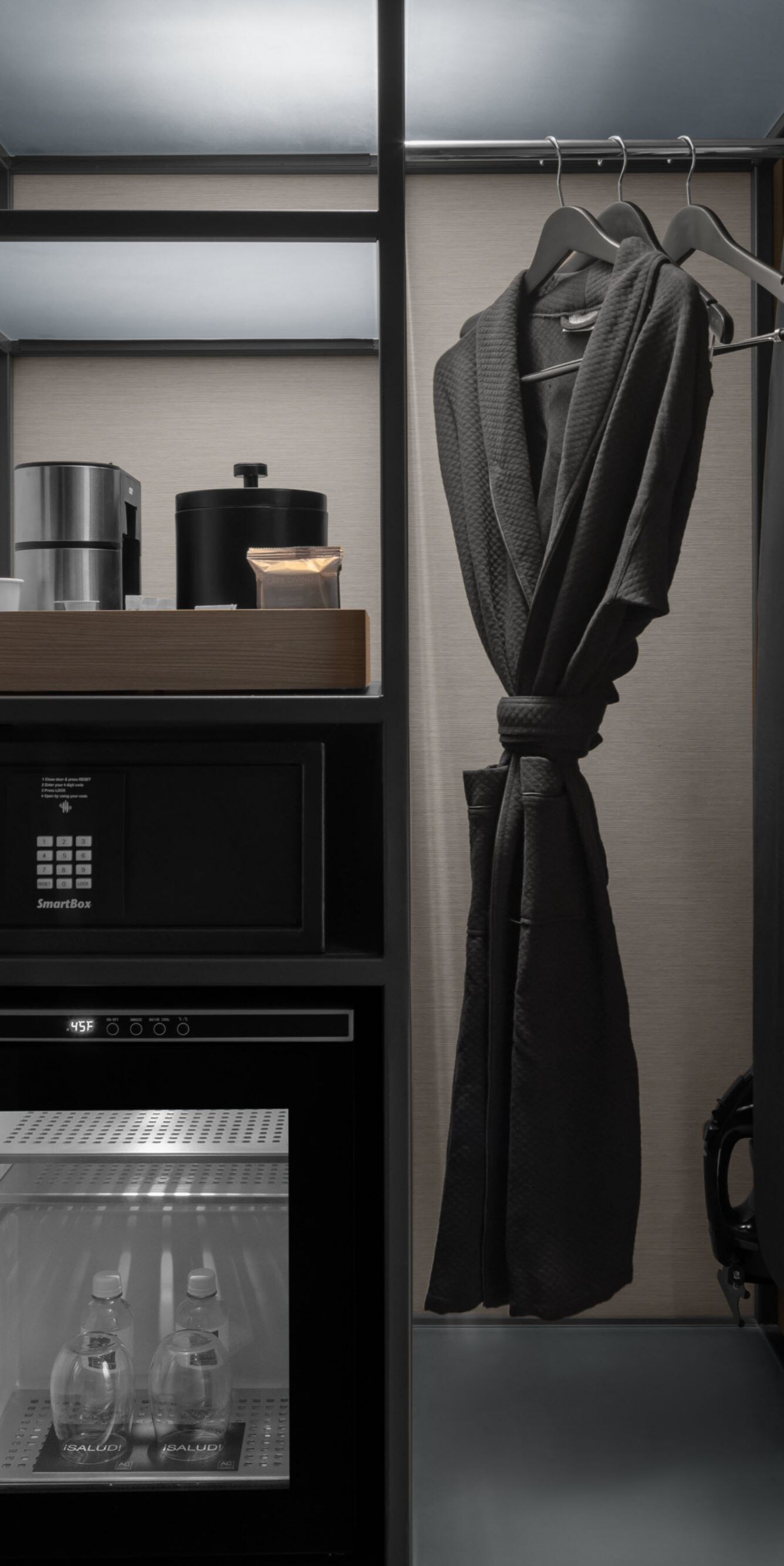 Guest room closet with mini fridge and safe