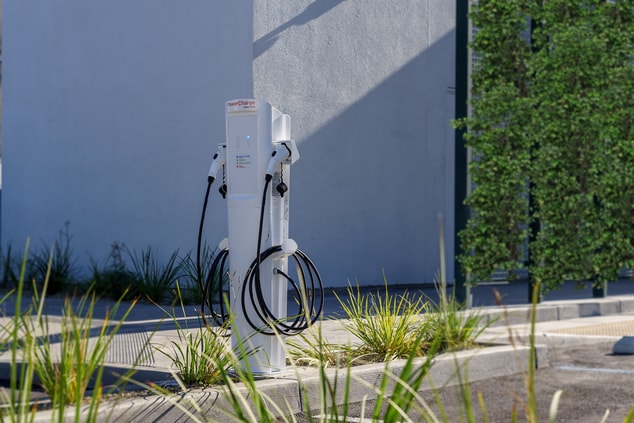 Electric vehicle charging station in parking lot.