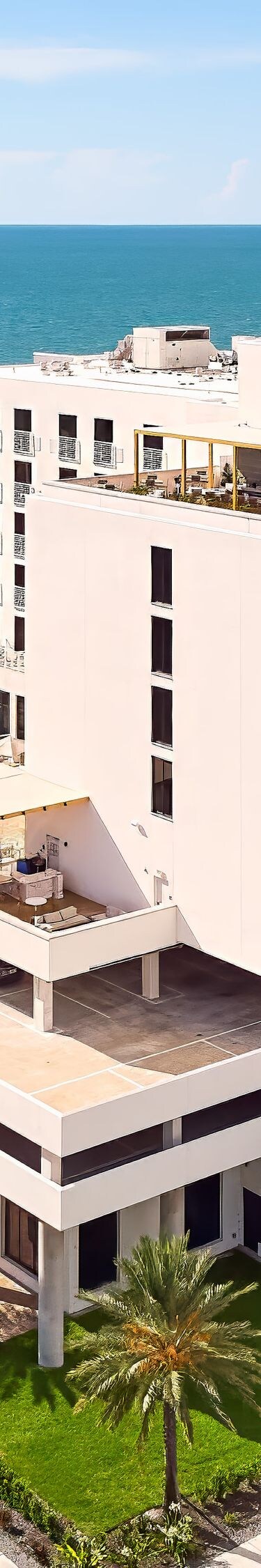 Exterior view with rooftop pool and sea