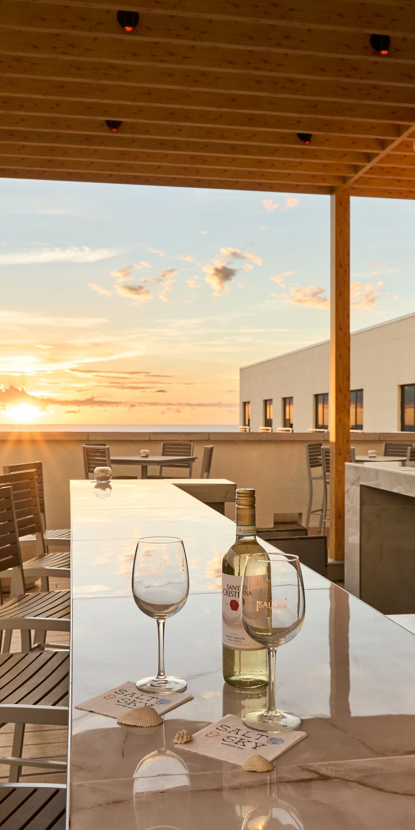 Rooftop bar with sunset and sea views