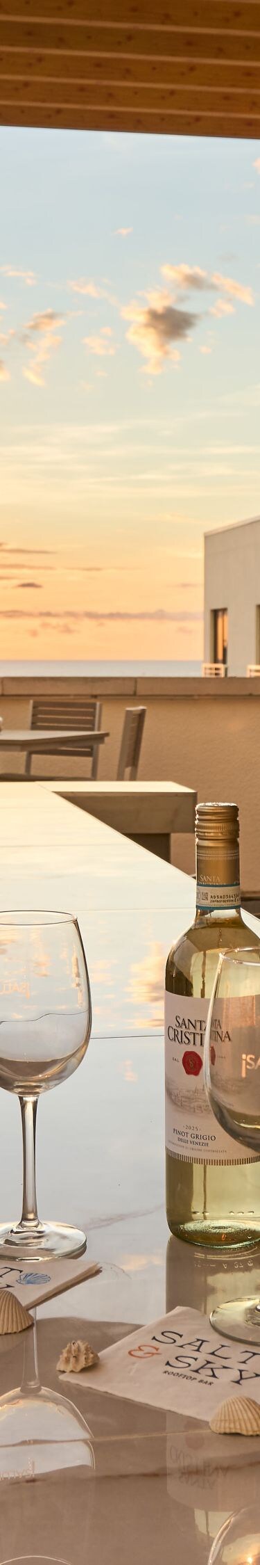 Rooftop bar with sunset and sea views