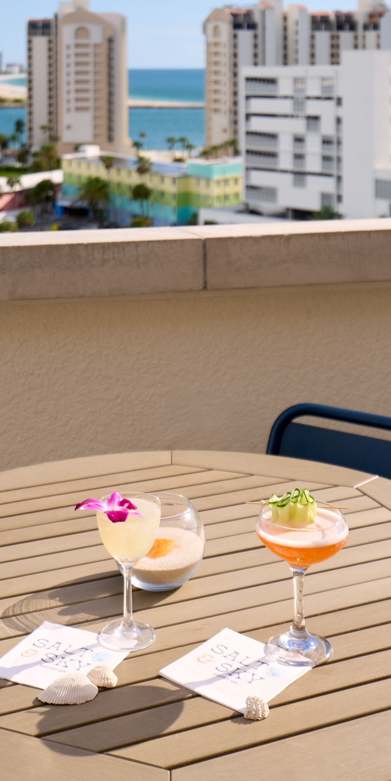 Cocktails on terrace with city skyline view