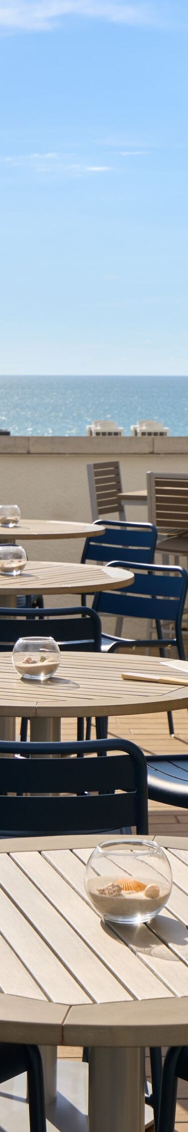 Rooftop terrace with sea views and cocktails