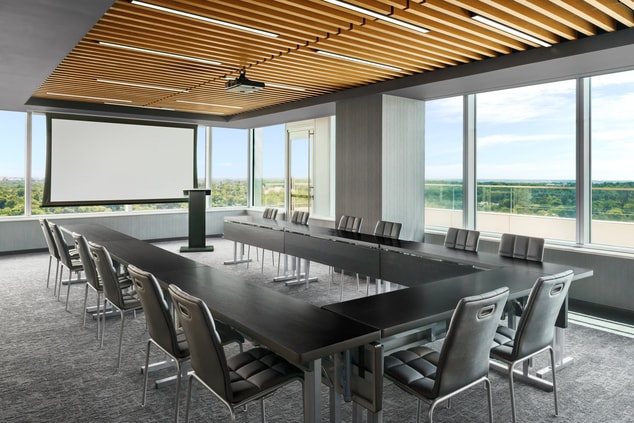 Upscale U shaped conference room with windows  
