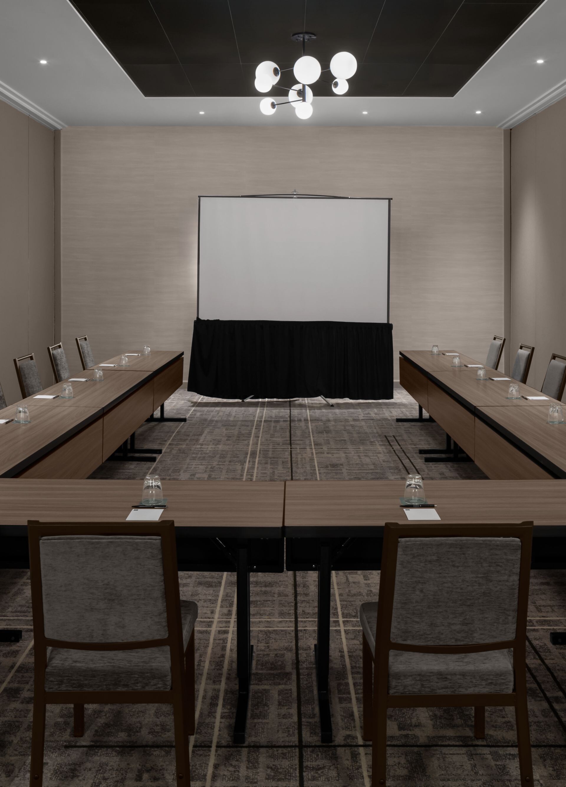 Meeting room with table, chairs, screem